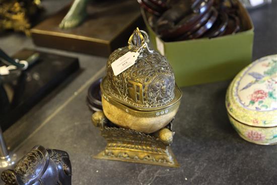 A Tibetan brass mounted human skull kapala, 19th century, 27.5cm